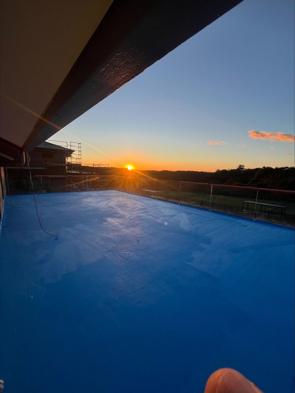 Sunset over a freshly sealed roof